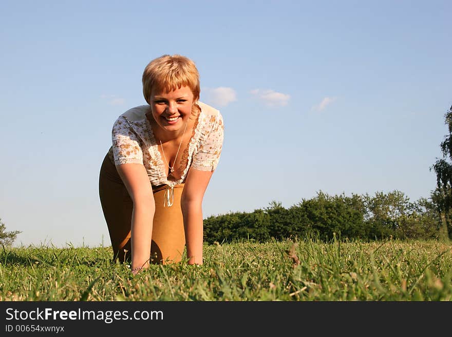 Girl all fours on meadow