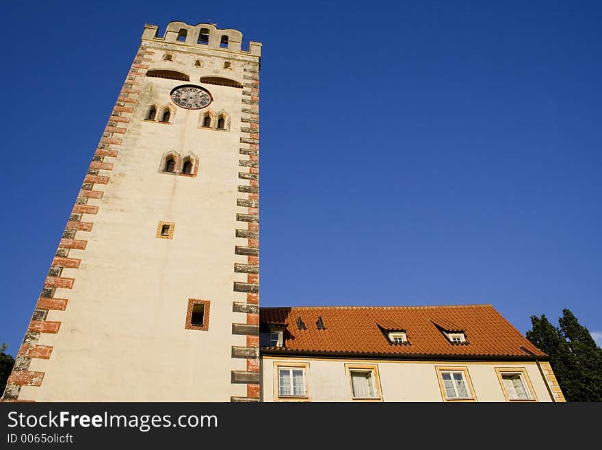 Old clock tower on blue sky. Old clock tower on blue sky