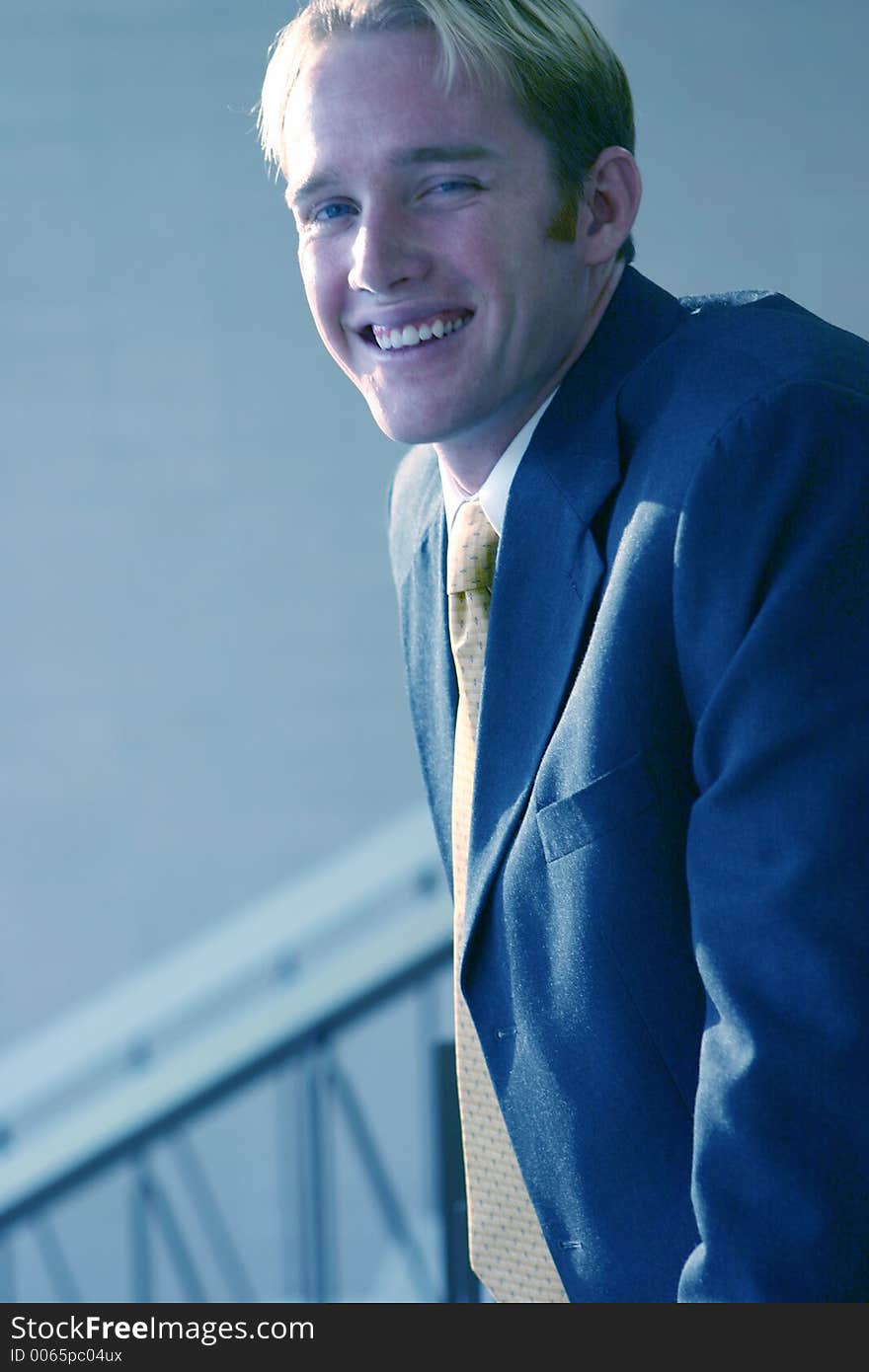 Blond hair blue eye businessman is smiling. Blond hair blue eye businessman is smiling