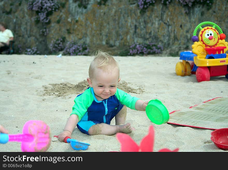 Small child exploring a beach in Cornwall. Small child exploring a beach in Cornwall.