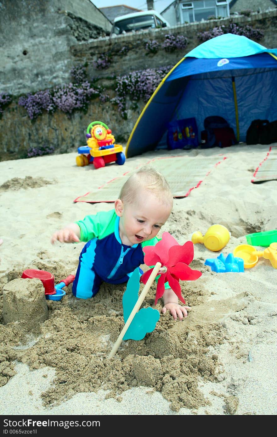 Small child exploring a beach in Cornwall. Small child exploring a beach in Cornwall.