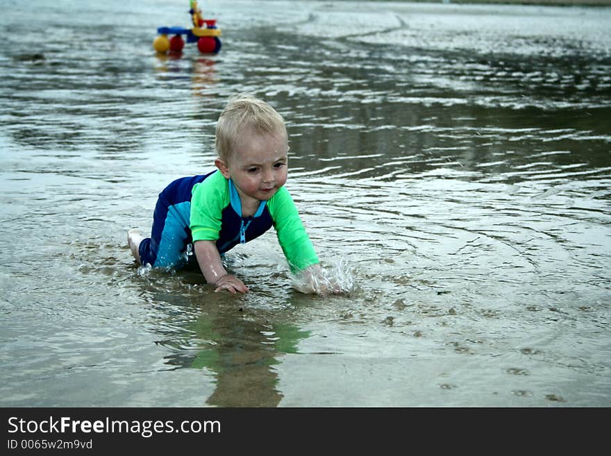 Small child exploring a beach in Cornwall. Small child exploring a beach in Cornwall.