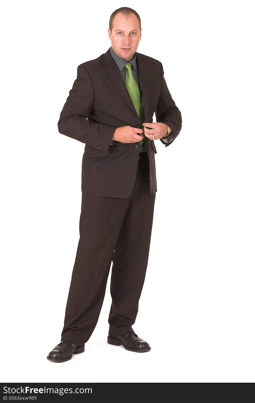 Businessman fastening jacket