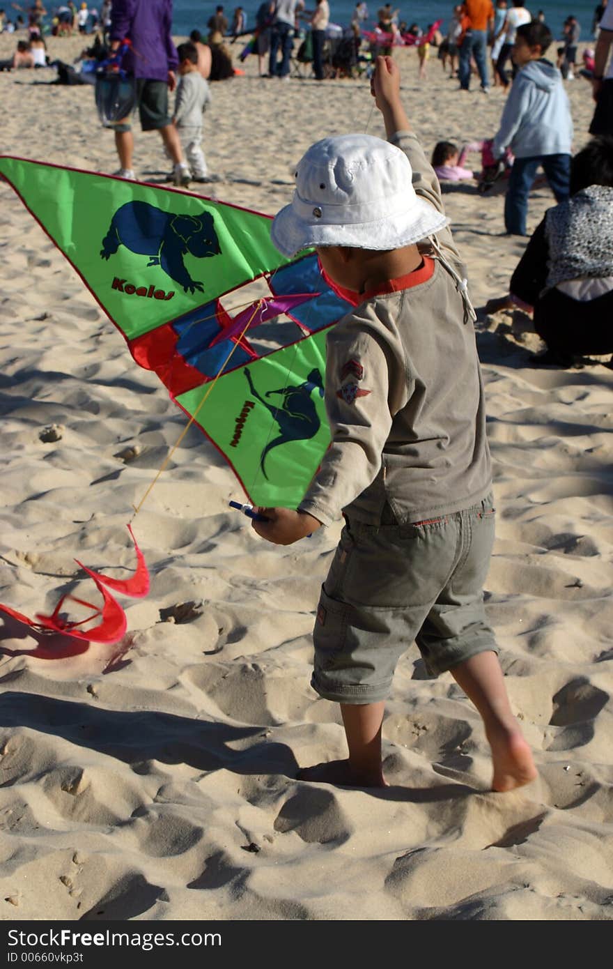 Little girl flying a kite with back to camera, Bondi Beach, Australia. Little girl flying a kite with back to camera, Bondi Beach, Australia