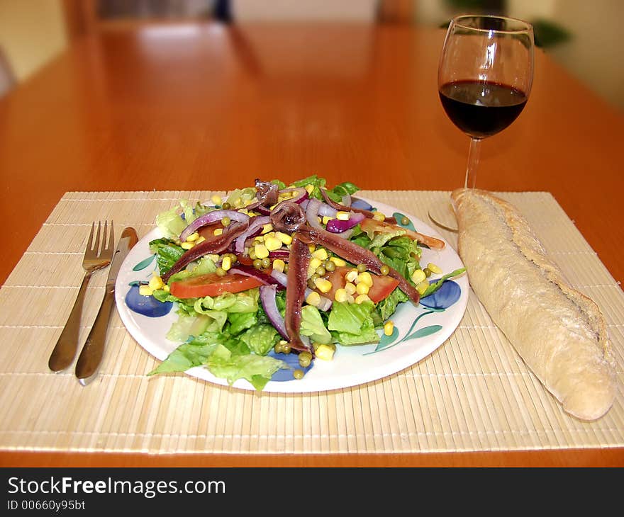 Salad whit bread and red wine. Salad whit bread and red wine