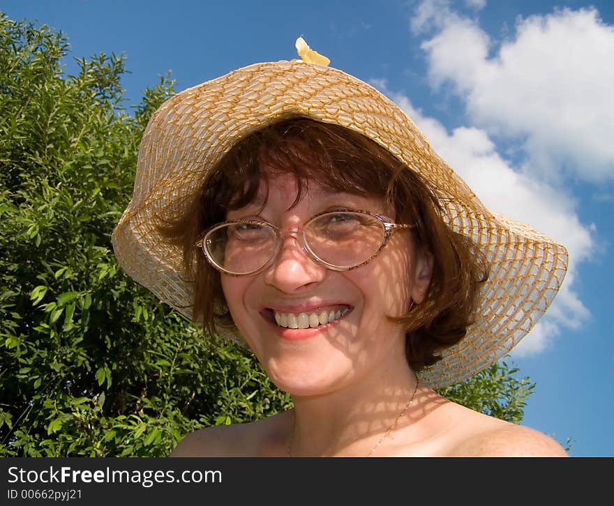 Girl in hat smiles. Girl in hat smiles