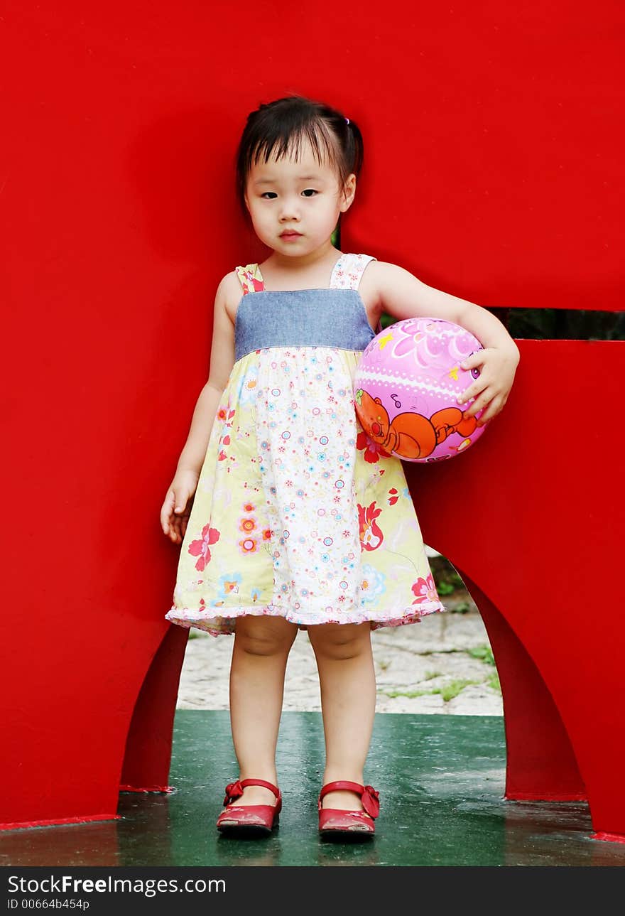 Cute Korean girl holding a ball