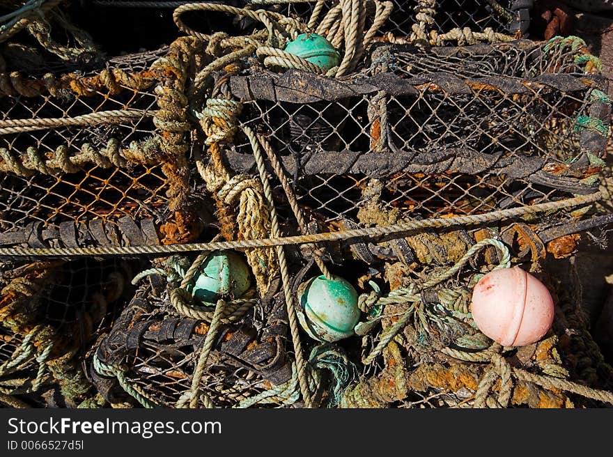 Lobster pots and rope tangled together. Lobster pots and rope tangled together.