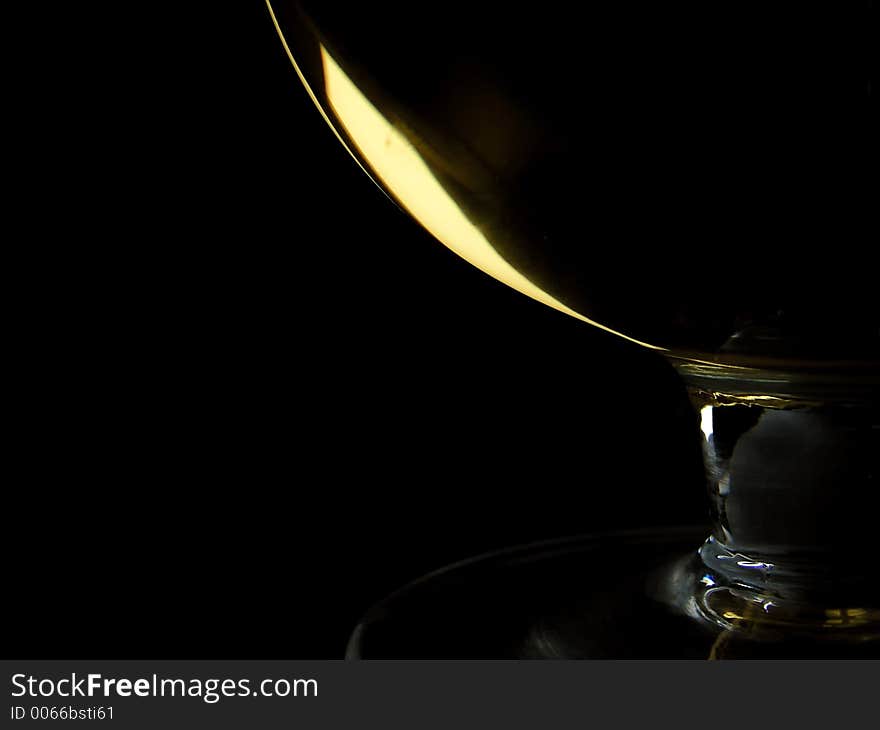 Sweet wine in glass on black background. Sweet wine in glass on black background