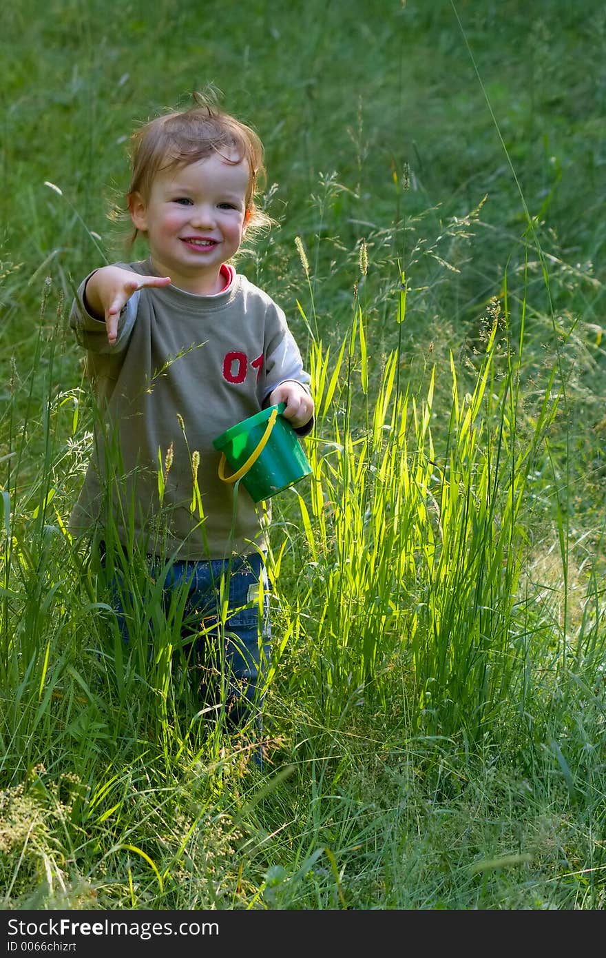 Boy stretches a hand towards