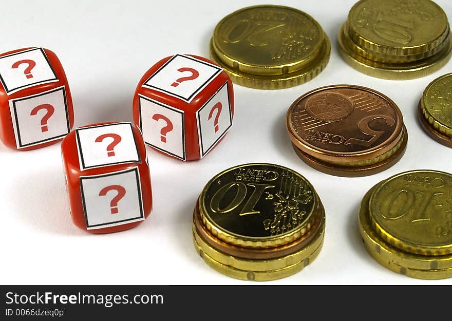 Several euro coins and dice with question simbol printed. Several euro coins and dice with question simbol printed