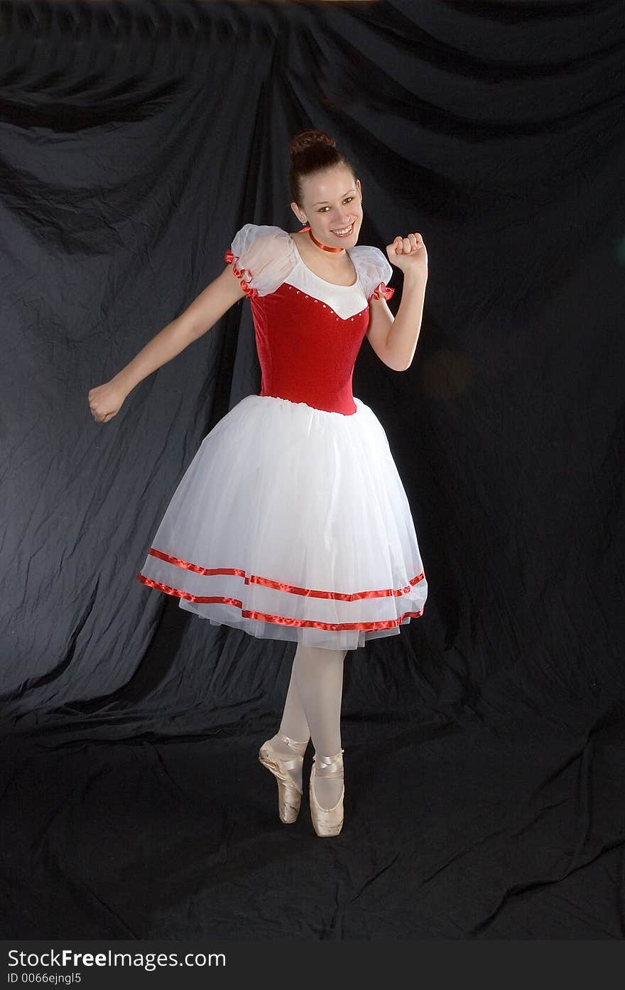 A ballerina steps out of character while on pointe to dance a different type of ballet. A ballerina steps out of character while on pointe to dance a different type of ballet.