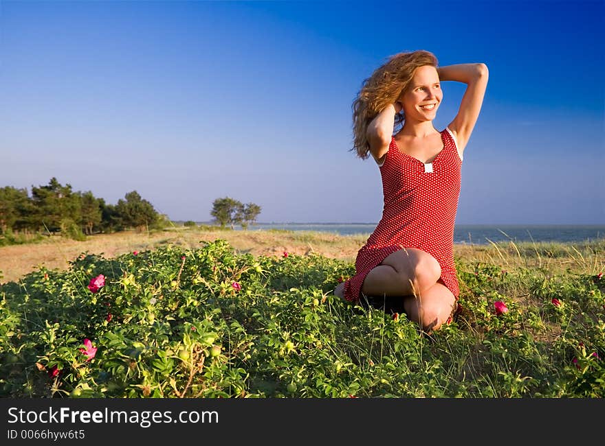 Girl sitting on a dune