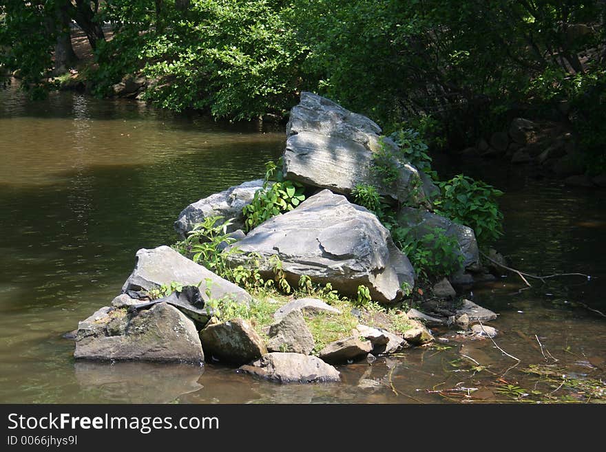 Rocks piled in lake. Rocks piled in lake