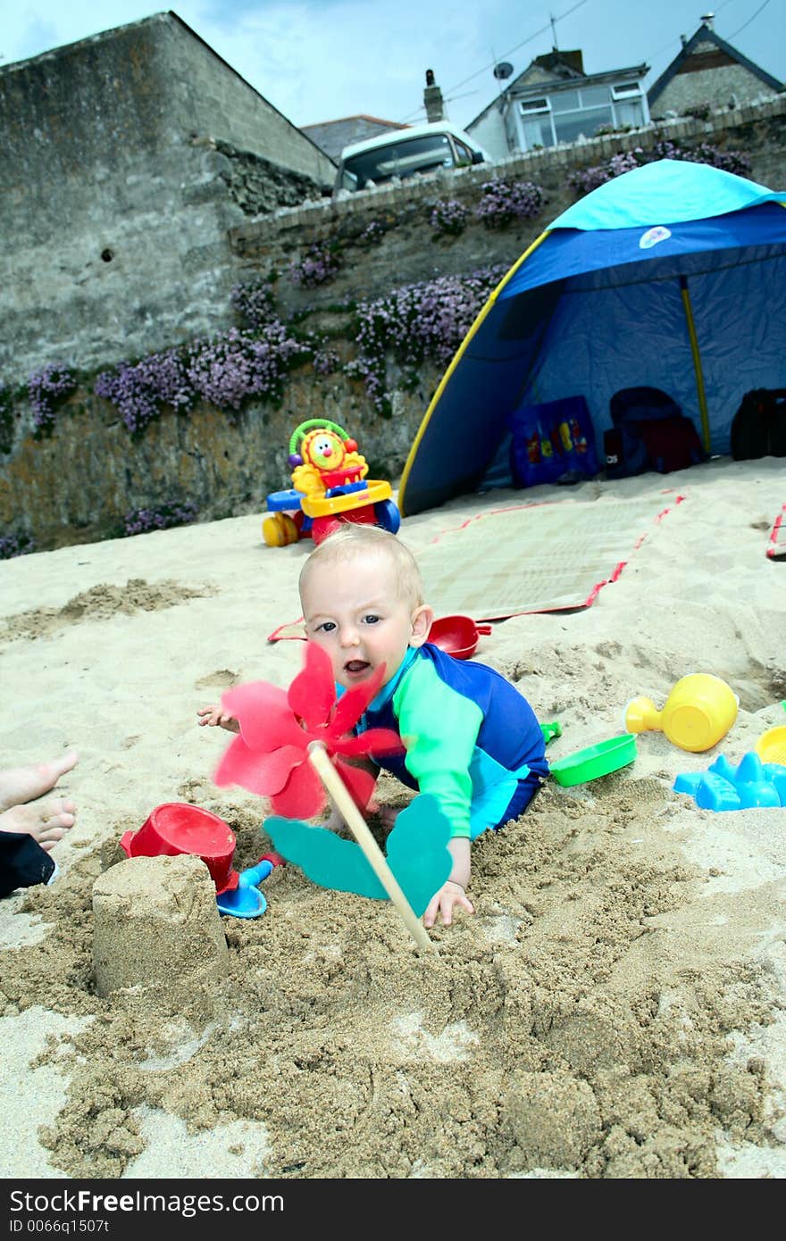 Small child exploring a beach in Cornwall. Small child exploring a beach in Cornwall.