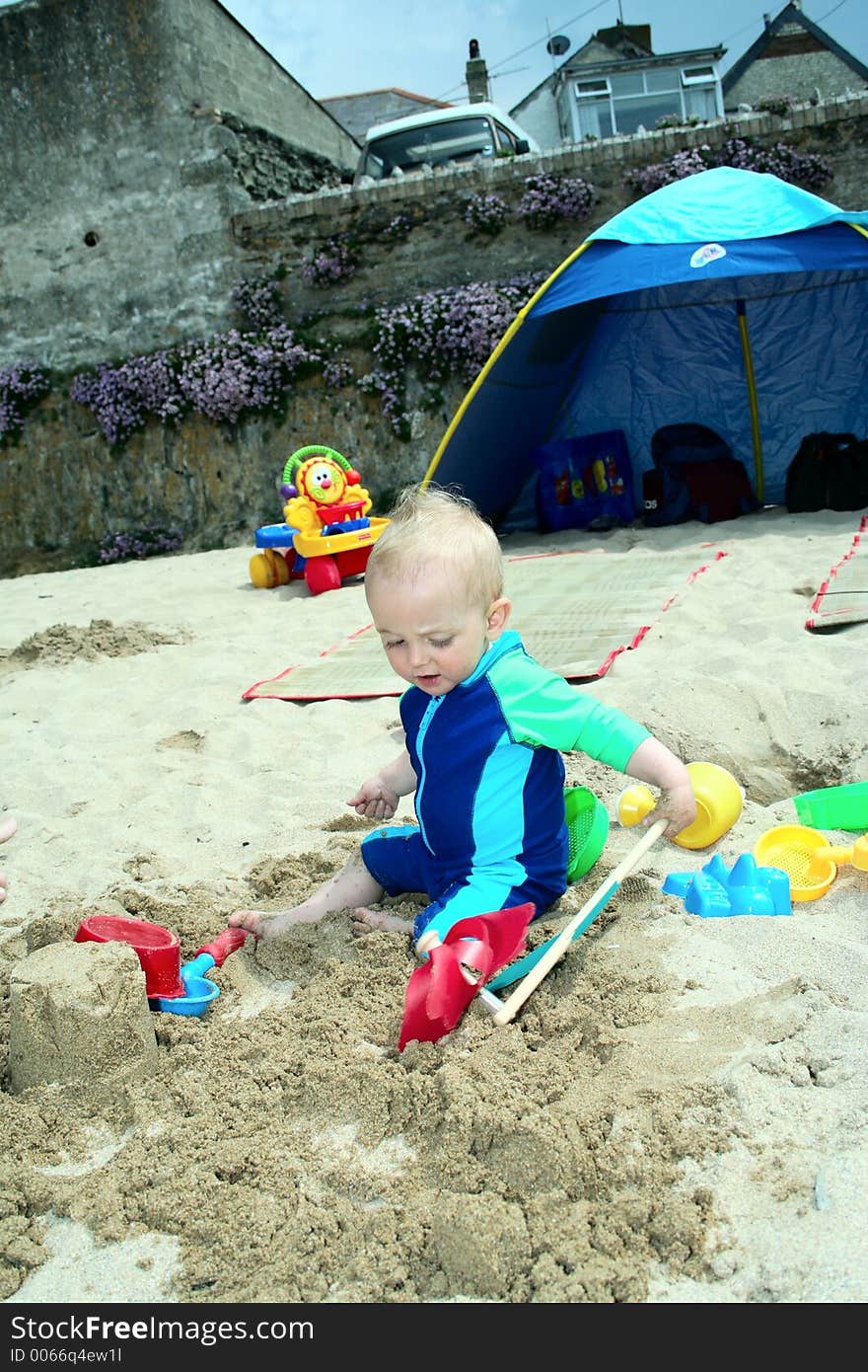 Small child exploring a beach in Cornwall. Small child exploring a beach in Cornwall.