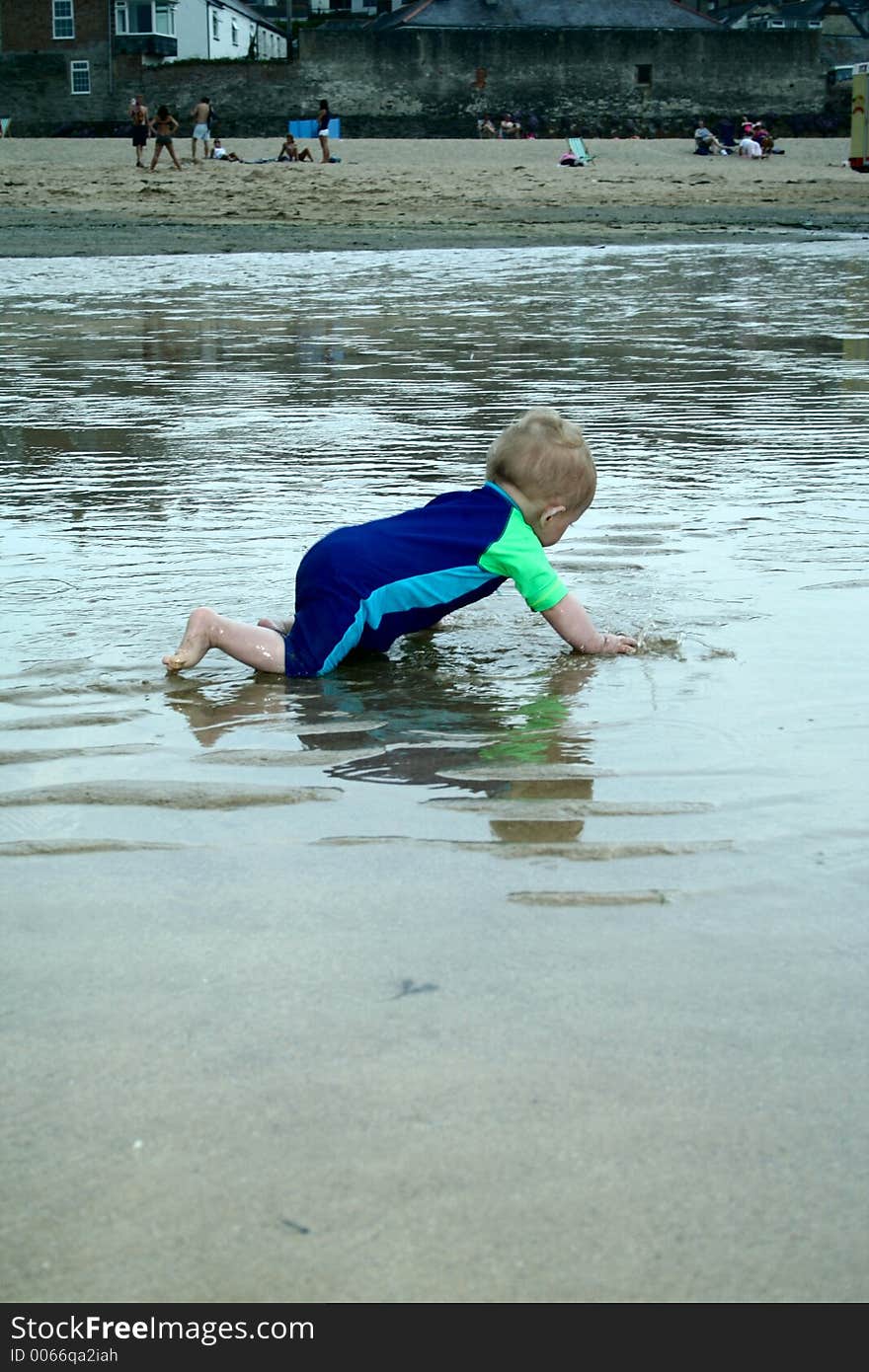 Small child exploring a beach in Cornwall. Small child exploring a beach in Cornwall.