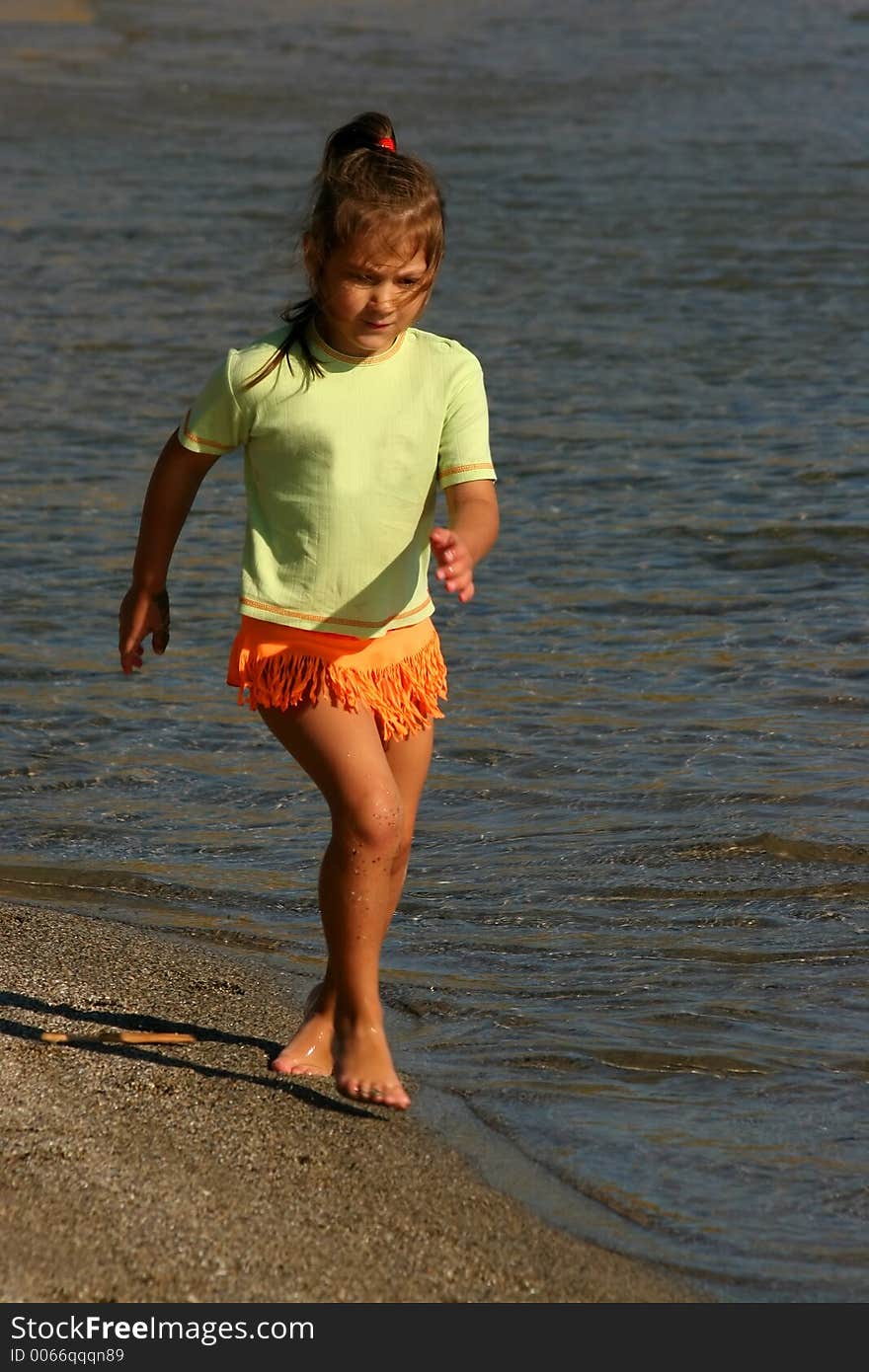 Little girl running on beach