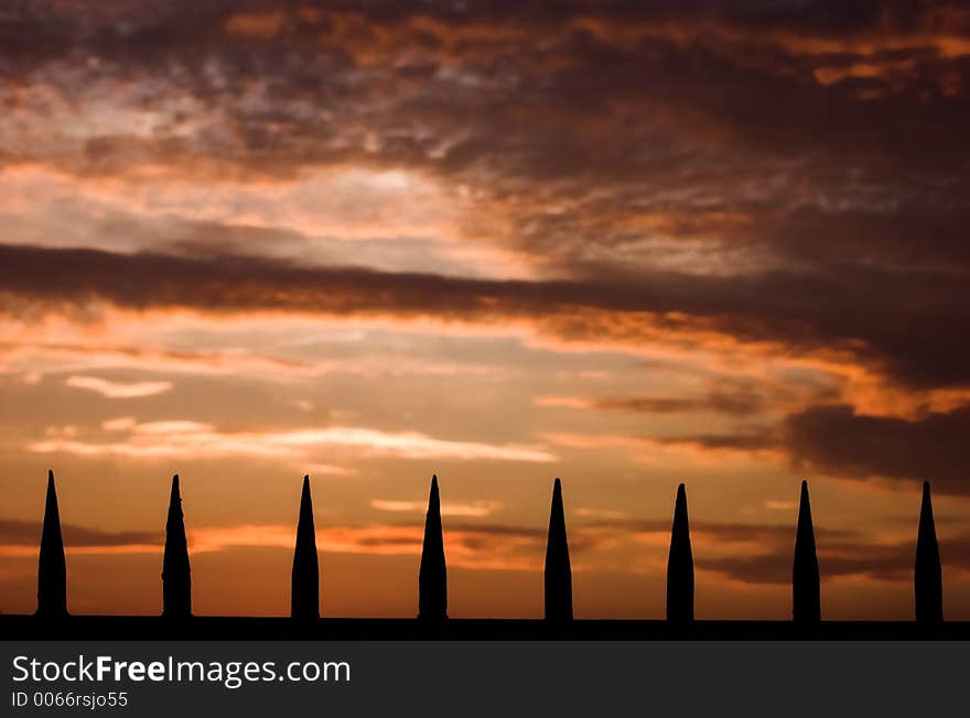 Spikes on sunset background