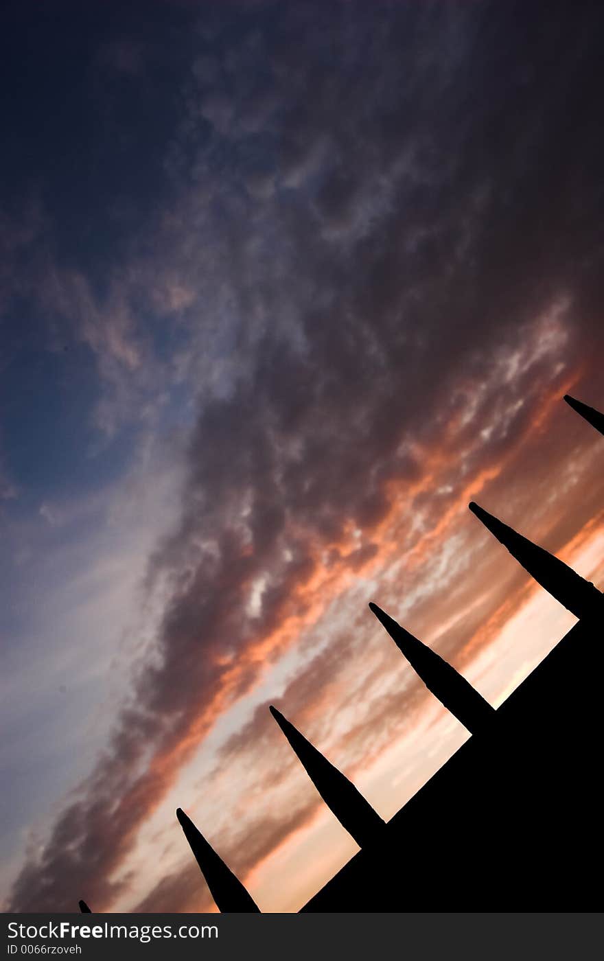 Spikes on sunset background