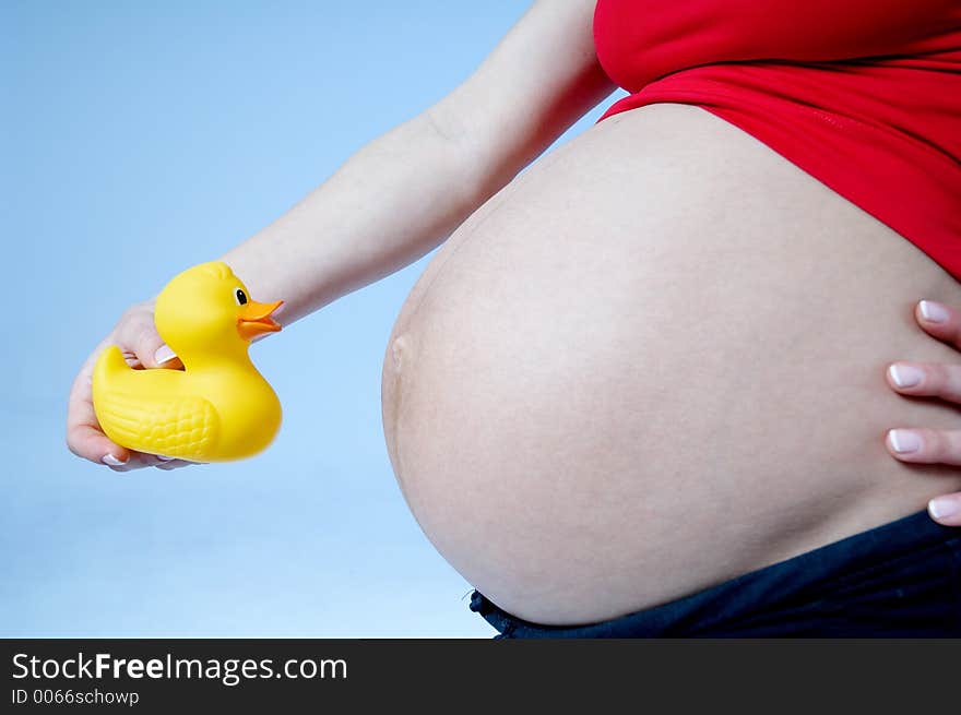 Pregnant woman with toy. Pregnant woman with toy