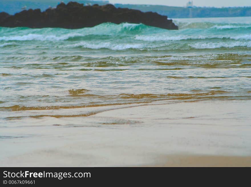 Waves on a beach in Porth Cornwall. Waves on a beach in Porth Cornwall