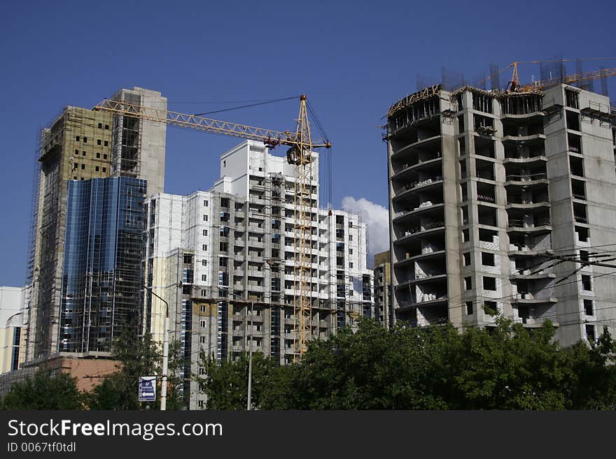 Construction of a building on a background of the blue sky