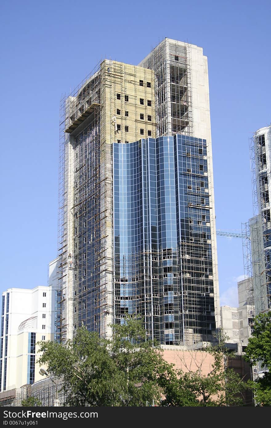 Construction of a building on a background of the blue sky