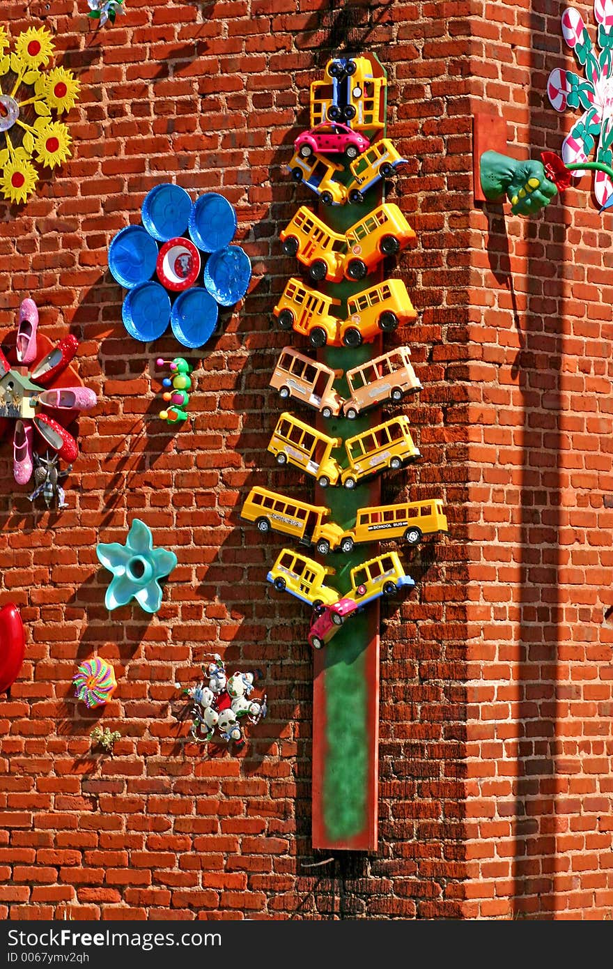 Whimsical, bright and funny small aculptures made from ordinary objects mounted on wall. Whimsical, bright and funny small aculptures made from ordinary objects mounted on wall