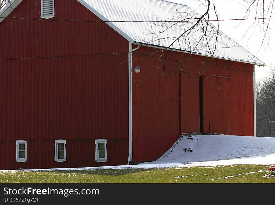 Red barn with snow on and beside it. Red barn with snow on and beside it