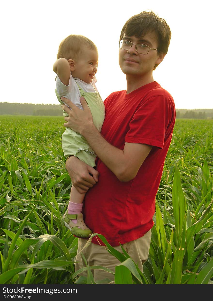 Father with baby in field 2