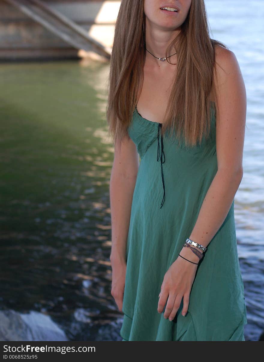 Summer girl under a boat dock