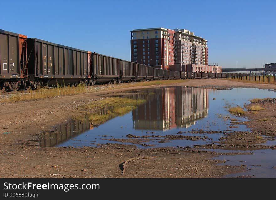 A train resting on the tracks near downtown Denver. A train resting on the tracks near downtown Denver