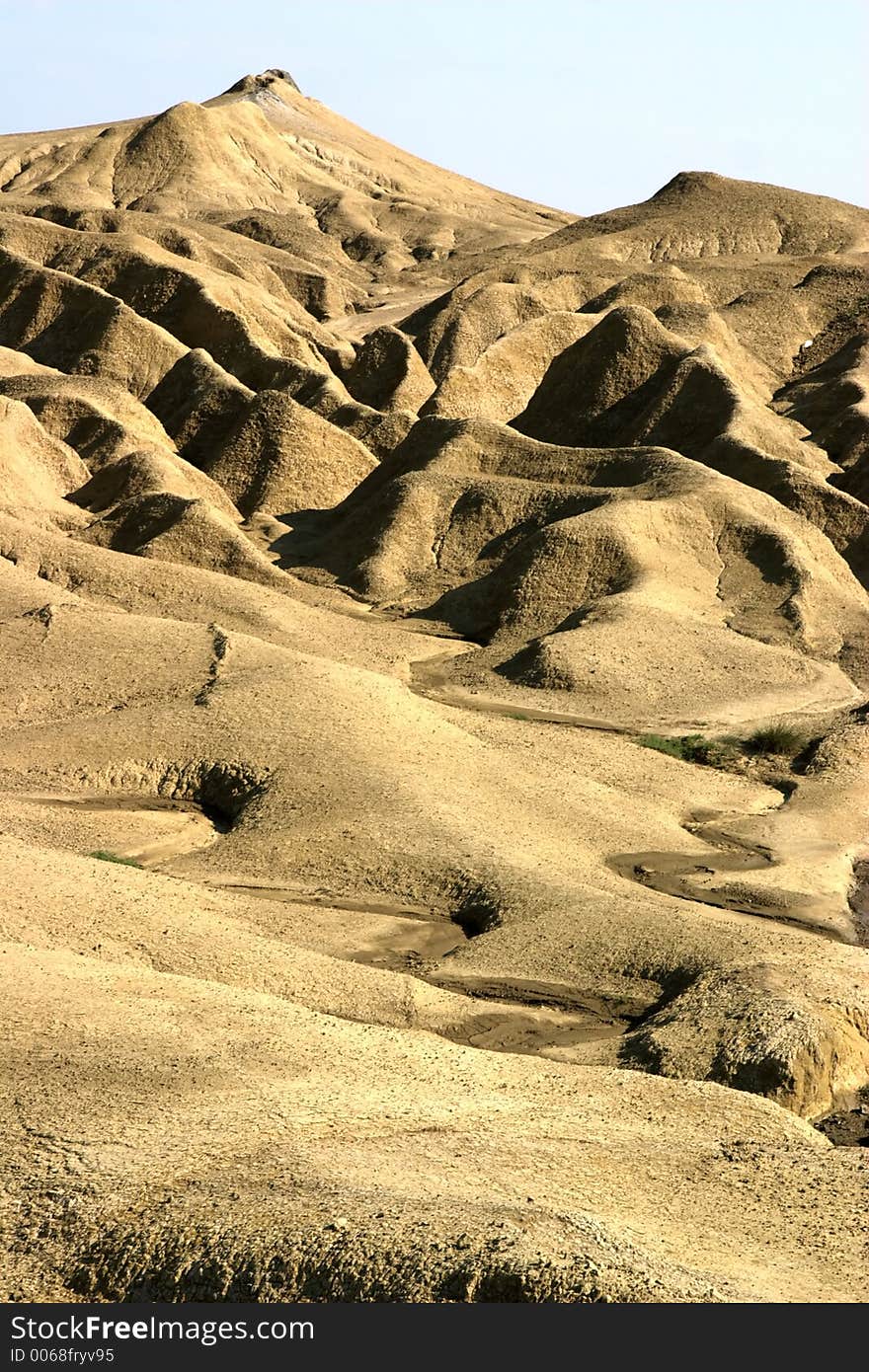 Mud hill landscape portrait from Mud Volcanoes - Buzau, Romania (unique geological phenomenon in Europe where the earth gas reaches the surface thrhu hills makeing small Mud volcanoes)