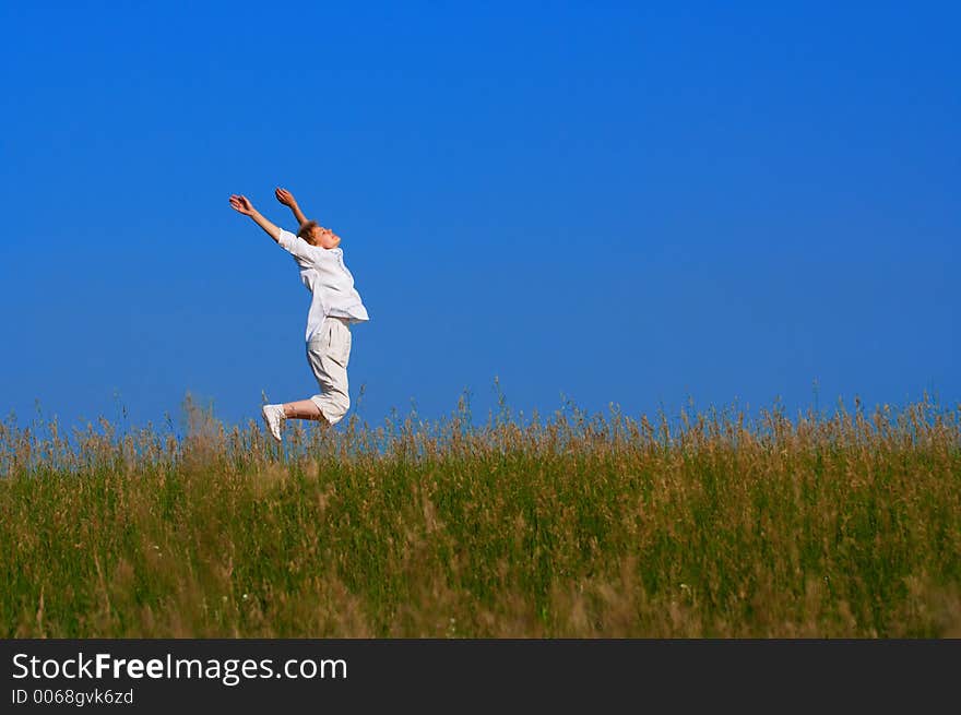 beauty girl jumping in field