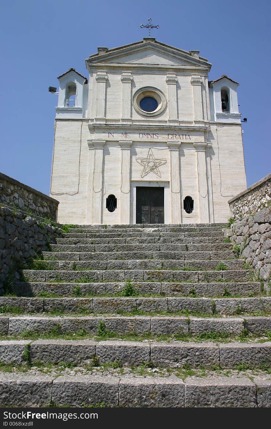 Ancient steps leading up to an old stone church. Ancient steps leading up to an old stone church