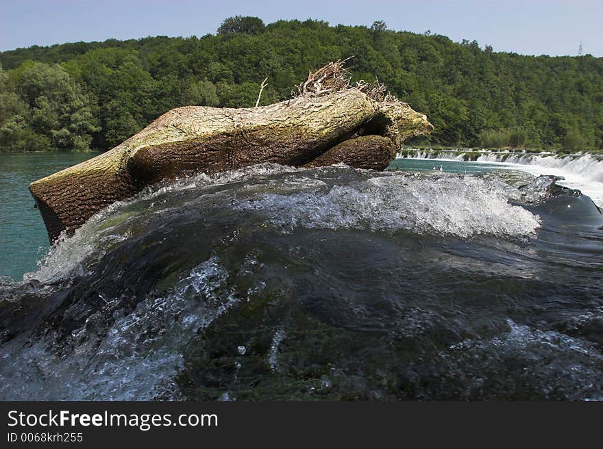 Log hangs at the fall. Log hangs at the fall