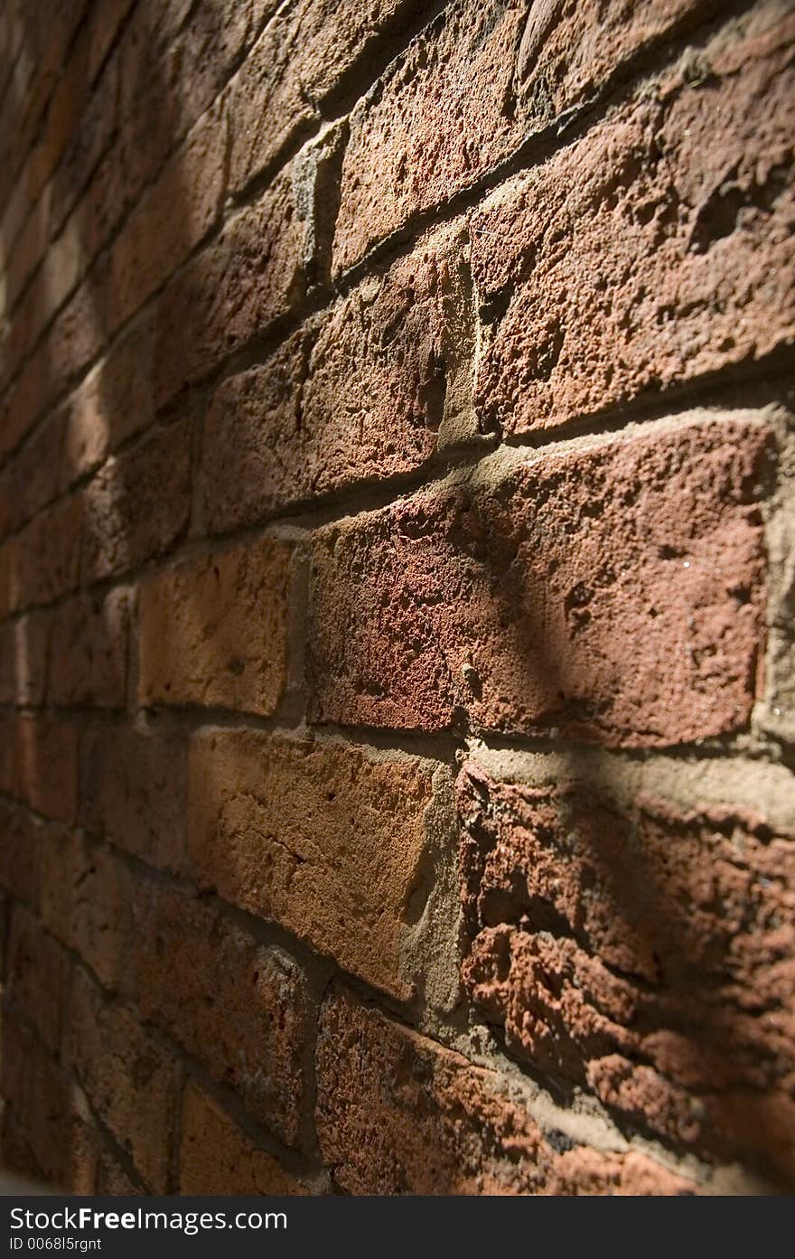 Textured brick wall with shadows and highlights