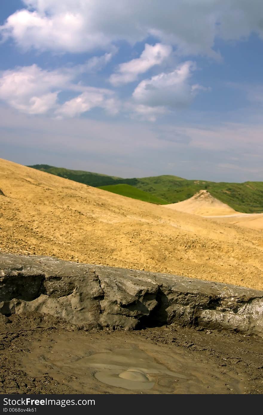 Active volcano mud crater from Mud Volcanoes - Buzau, Romania (unique geological phenomenon in Europe where the earth gas reaches the surface through hills making small Mud volcanoes). Active volcano mud crater from Mud Volcanoes - Buzau, Romania (unique geological phenomenon in Europe where the earth gas reaches the surface through hills making small Mud volcanoes)