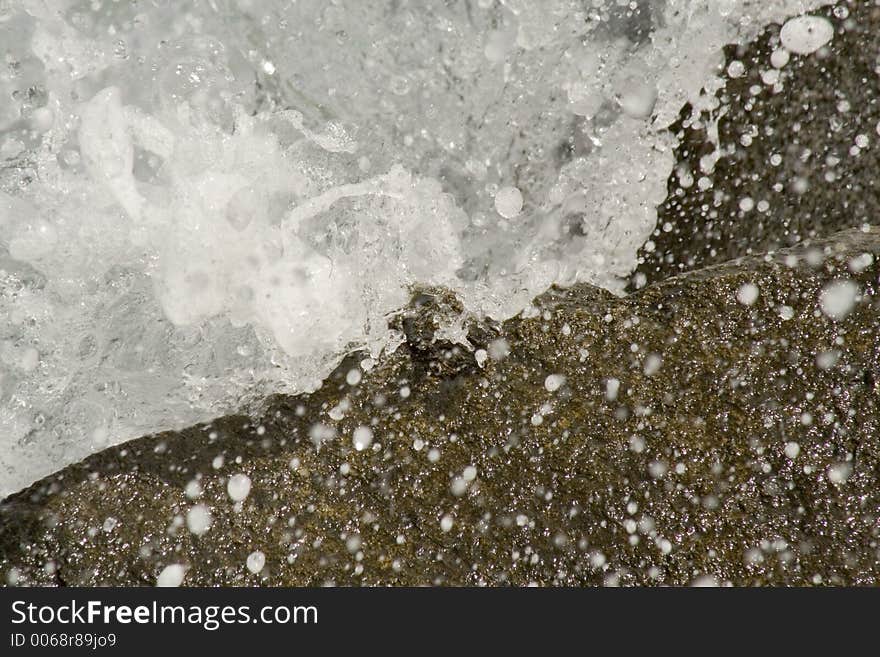 Water clashes onto rocks in the waters of Aruba. Water clashes onto rocks in the waters of Aruba