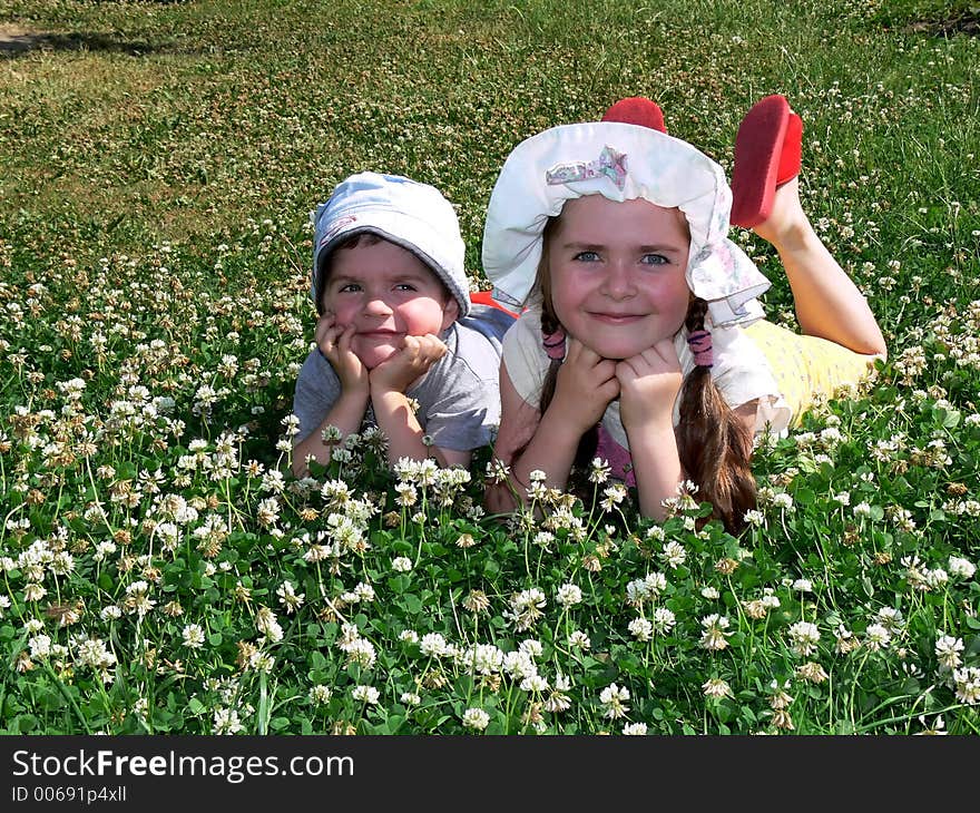 Boy and girl on a grass field. Boy and girl on a grass field