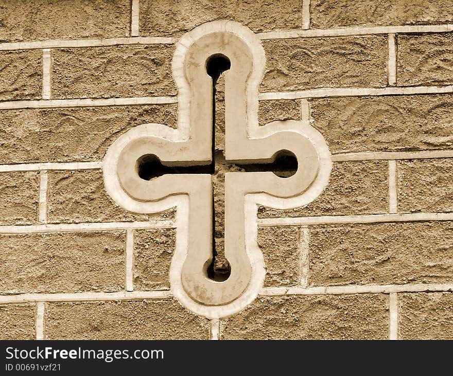 Antique cross on building