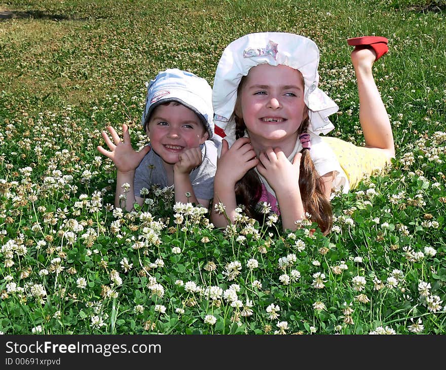 Boy and girl on a grass field. Boy and girl on a grass field