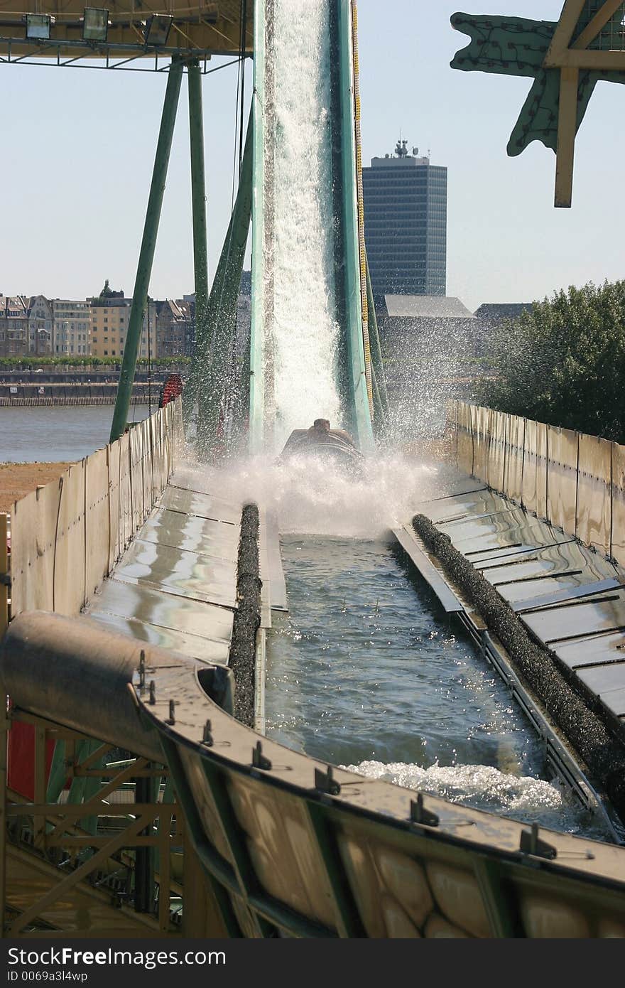 People enjoying the refreshment on a white water coaster during a hot summerday. People enjoying the refreshment on a white water coaster during a hot summerday