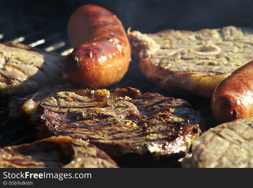 A chop of meat on the grill. A chop of meat on the grill