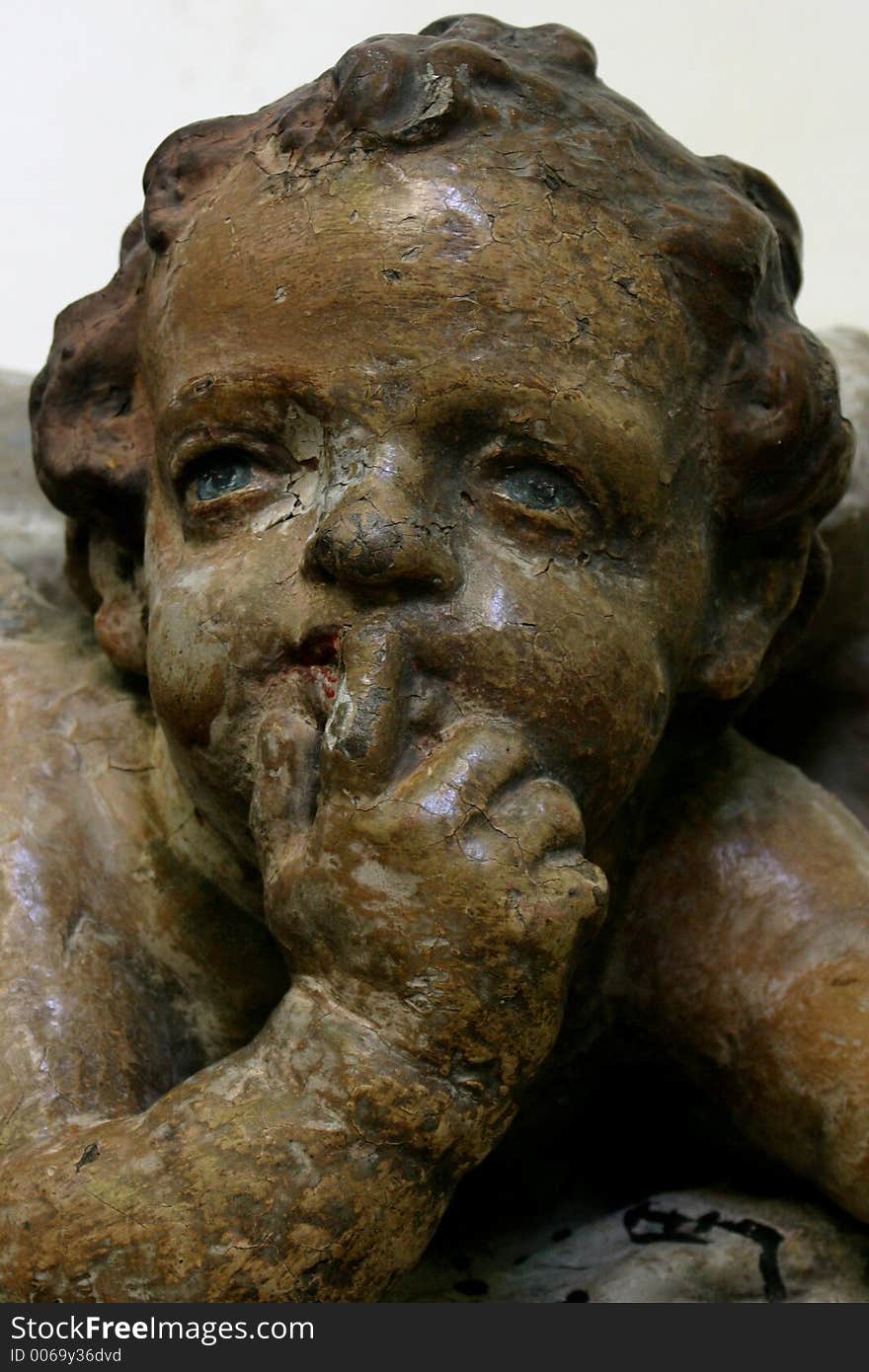 Bronze cherub shushing. Bronze cherub shushing