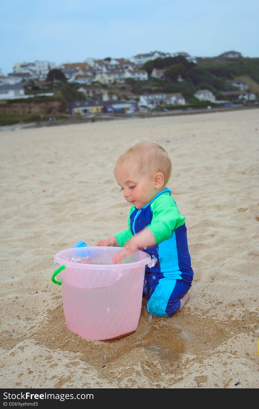 Small child exploring a beach in Cornwall. Small child exploring a beach in Cornwall.