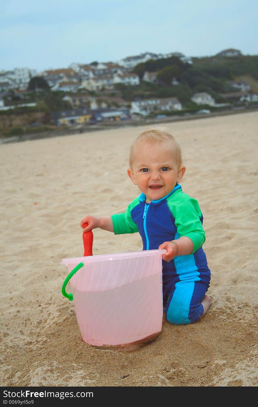 Small child exploring a beach in Cornwall. Small child exploring a beach in Cornwall.