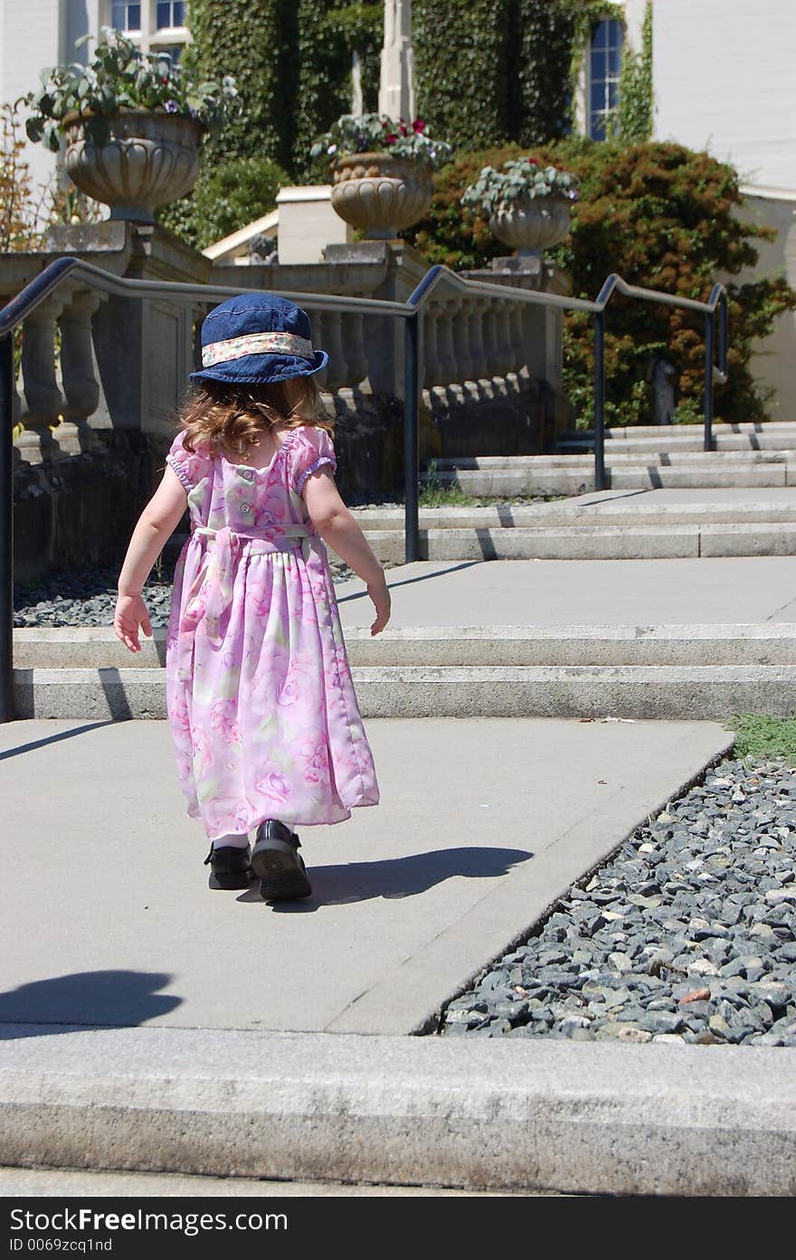 Girl walking up steps in colour