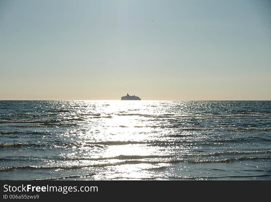 Sunset with boat by the horizon